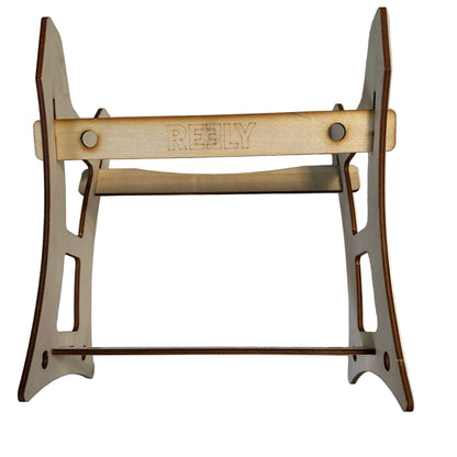 Wooden stand with 'RELY' branding on a white surface