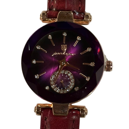 Watch with a purple face and red strap on a white background