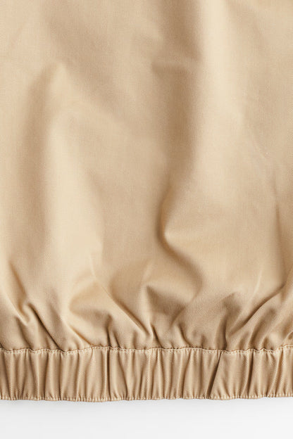 Close-up of beige fabric with a textured surface