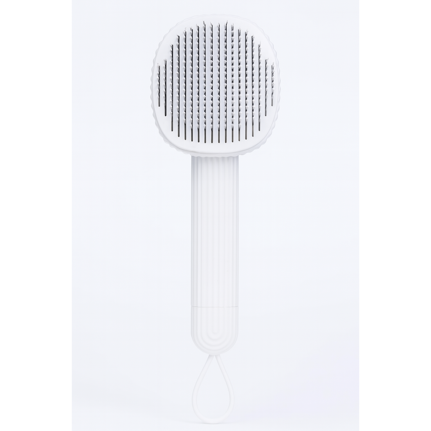 White pet brush with textured head on a white background