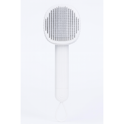 White pet brush with textured head on a white background