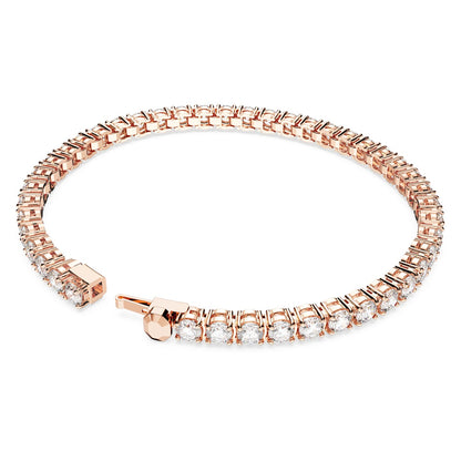 Rose gold bracelet with clear stones on a white background