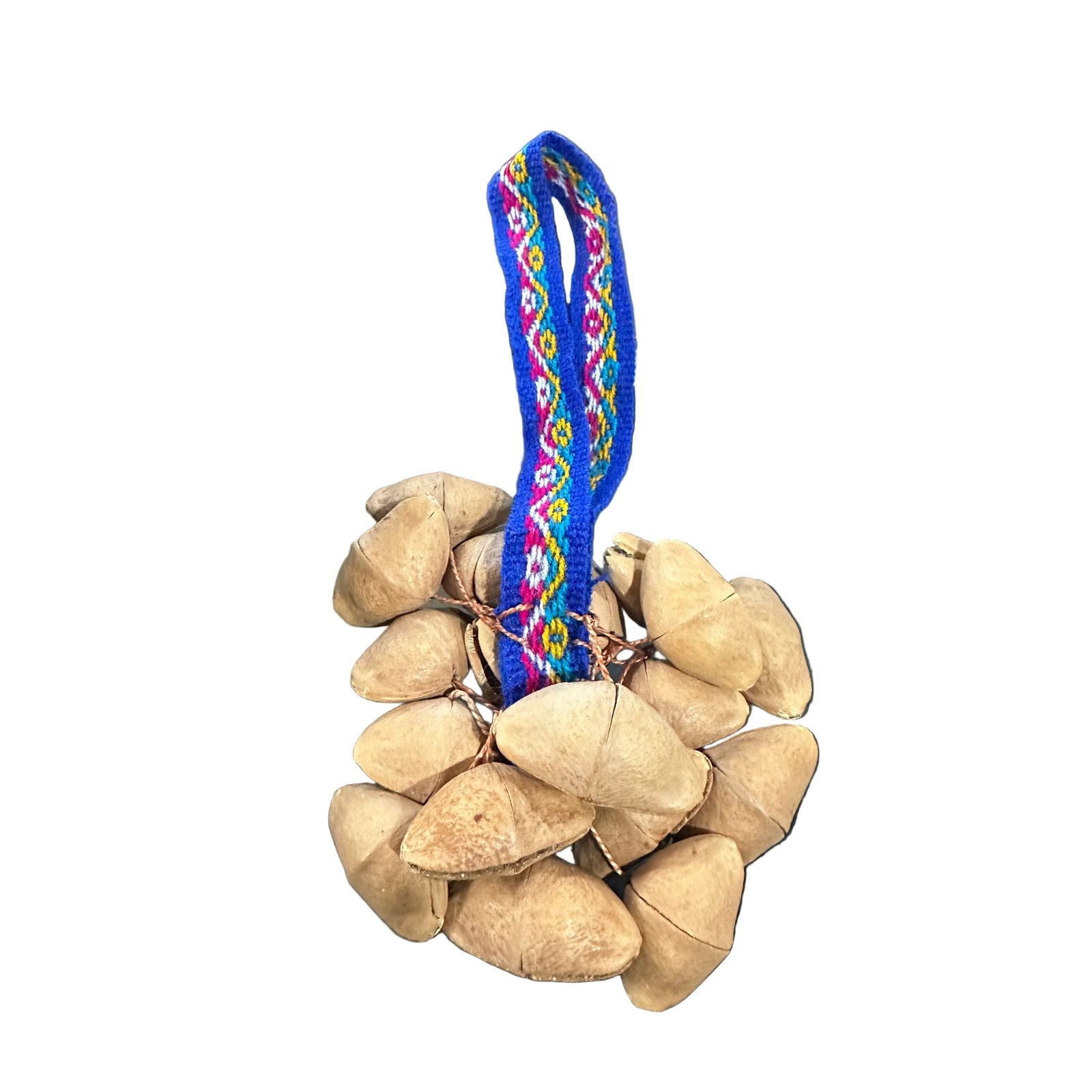 Ball of stones with a colorful woven strap on a desk with a laptop